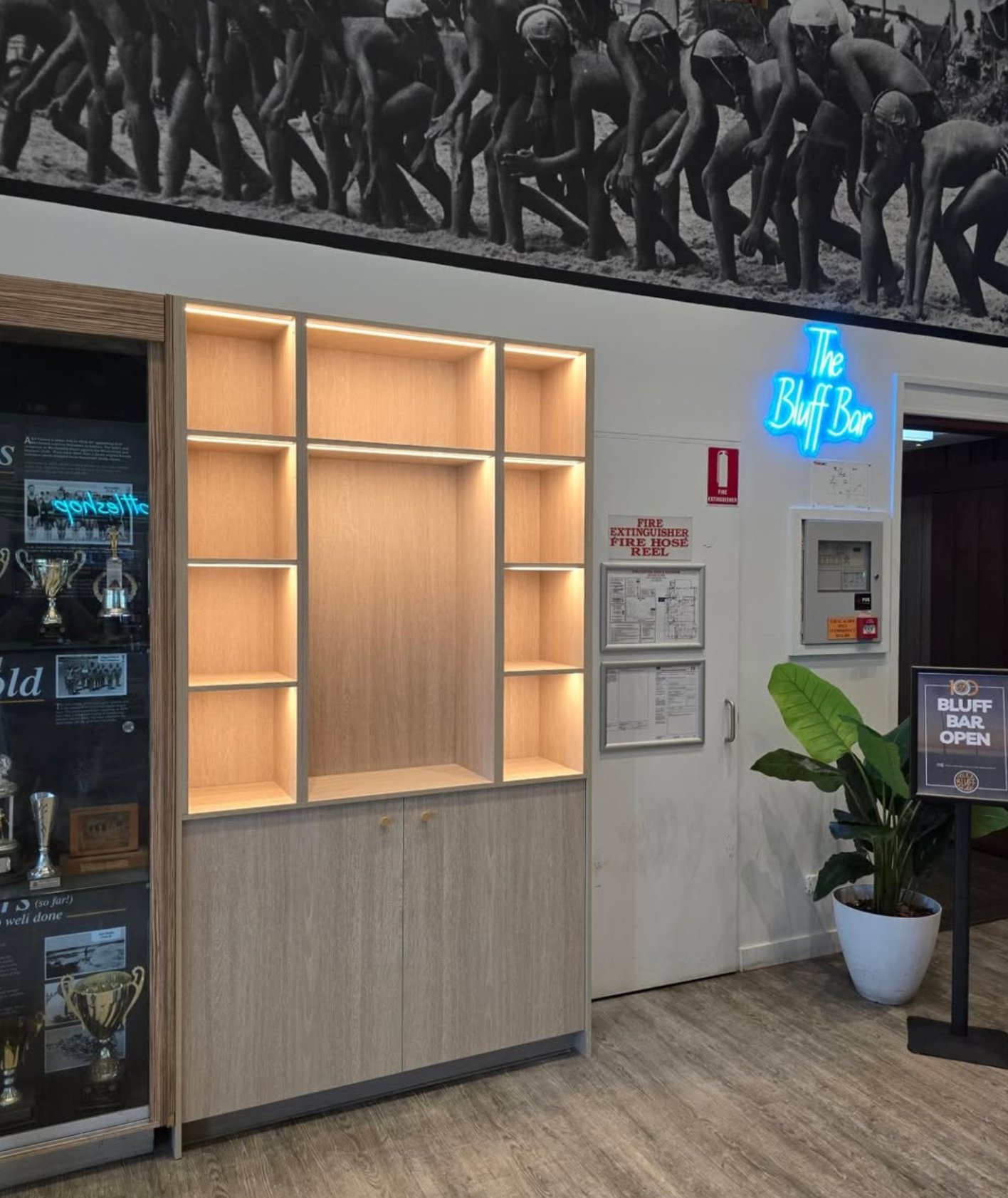 LED backlit shelving unit with neon sign — Bluff Bar, Noosa