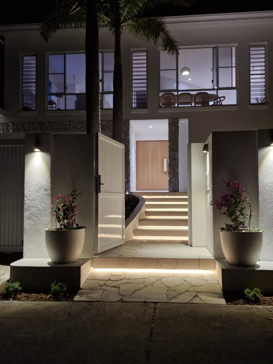 Outdoor entrance lighting installation at night — Wave Electrical Noosa