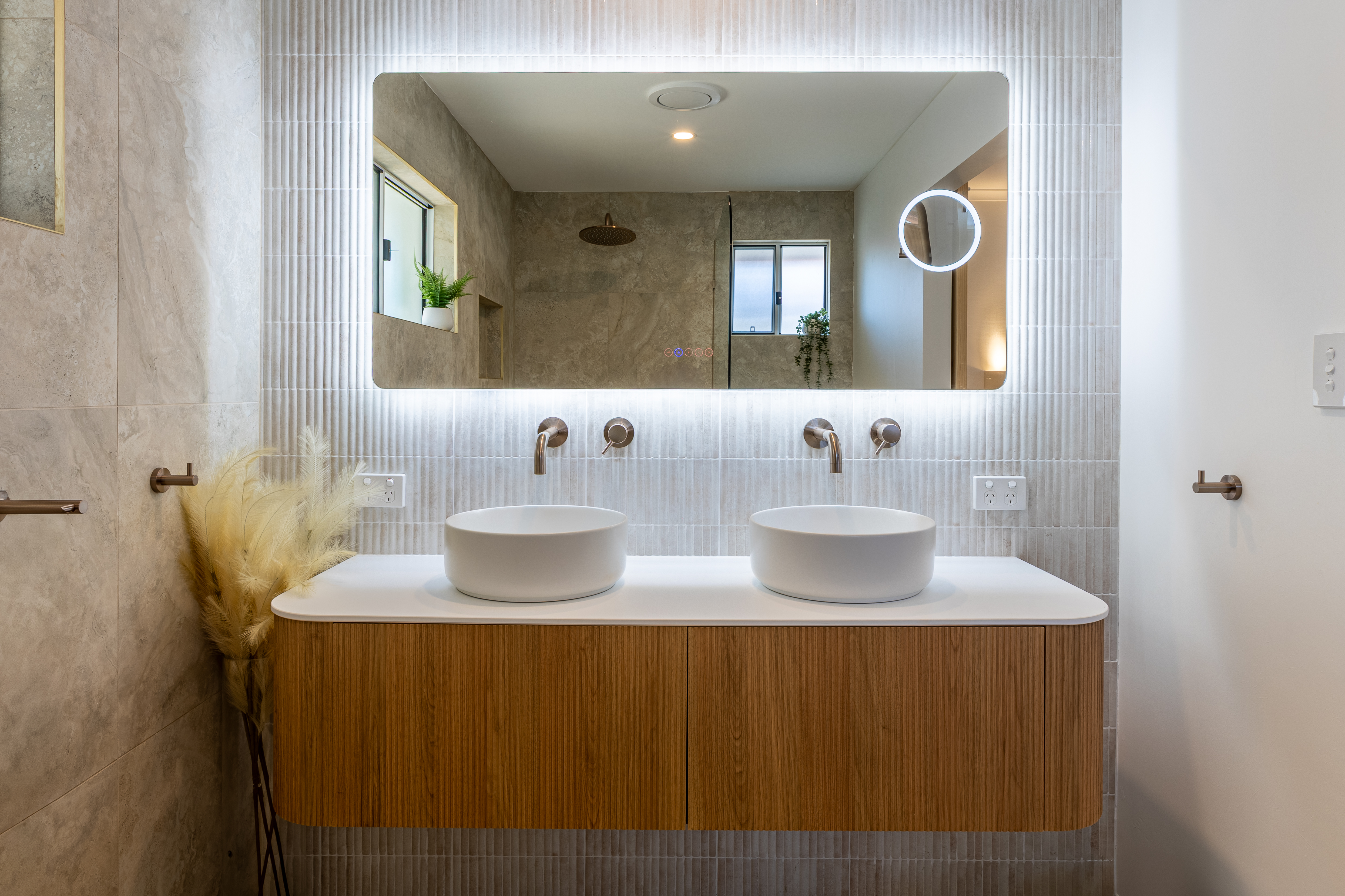 LED backlit mirror and downlights — Sunrise Beach bathroom renovation