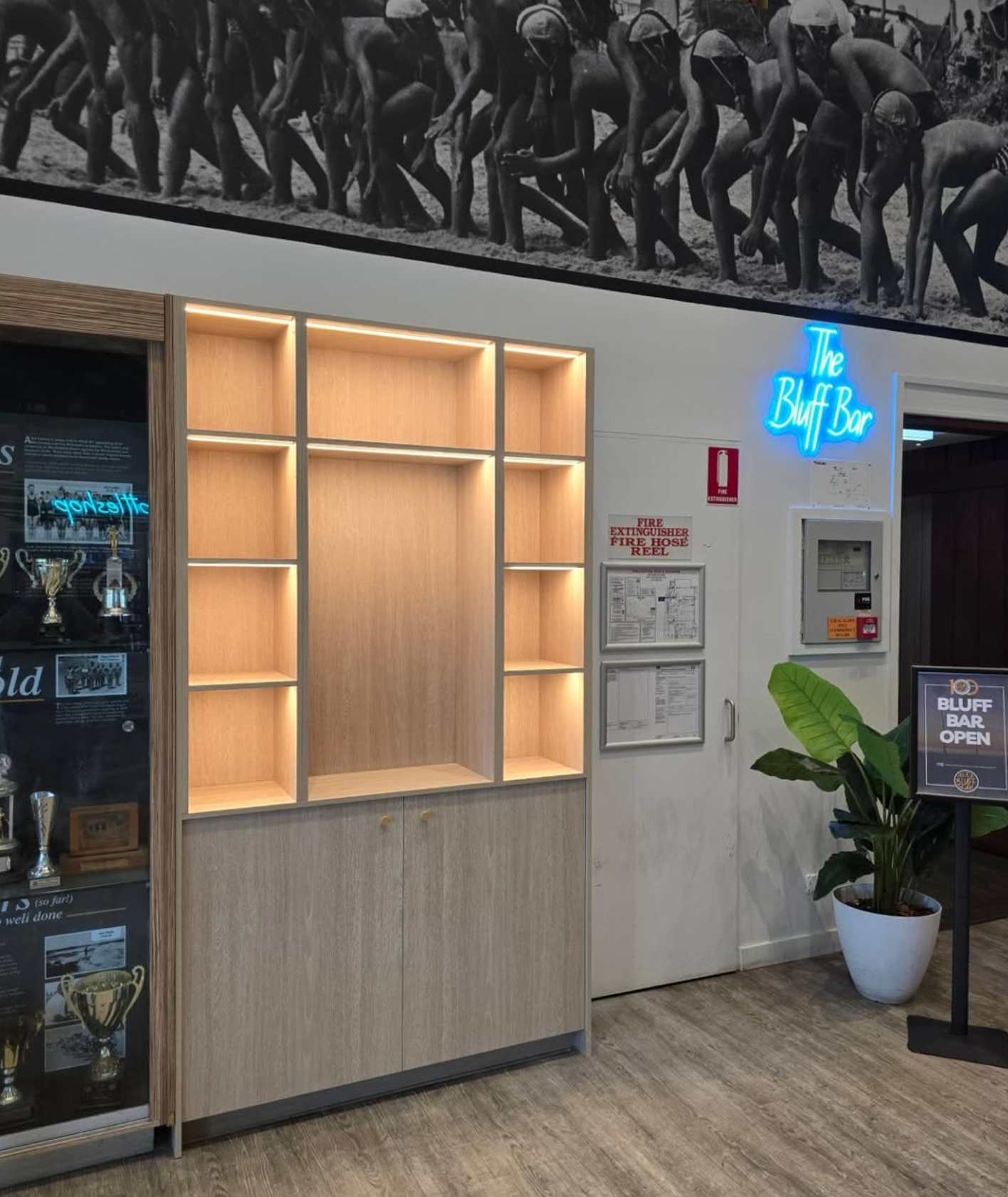 LED backlit shelving unit with neon sign — Bluff Bar, Noosa