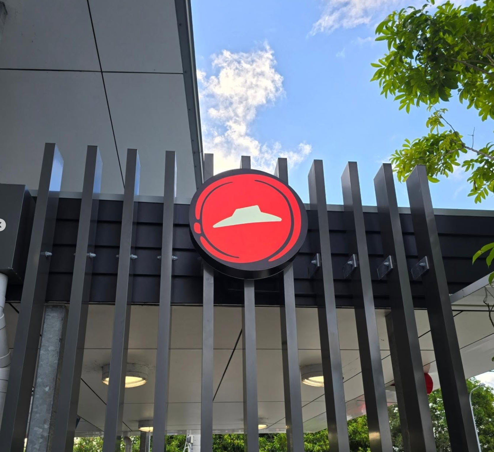 Pizza Hut illuminated circle logo sign — commercial signage wiring Sunshine Coast