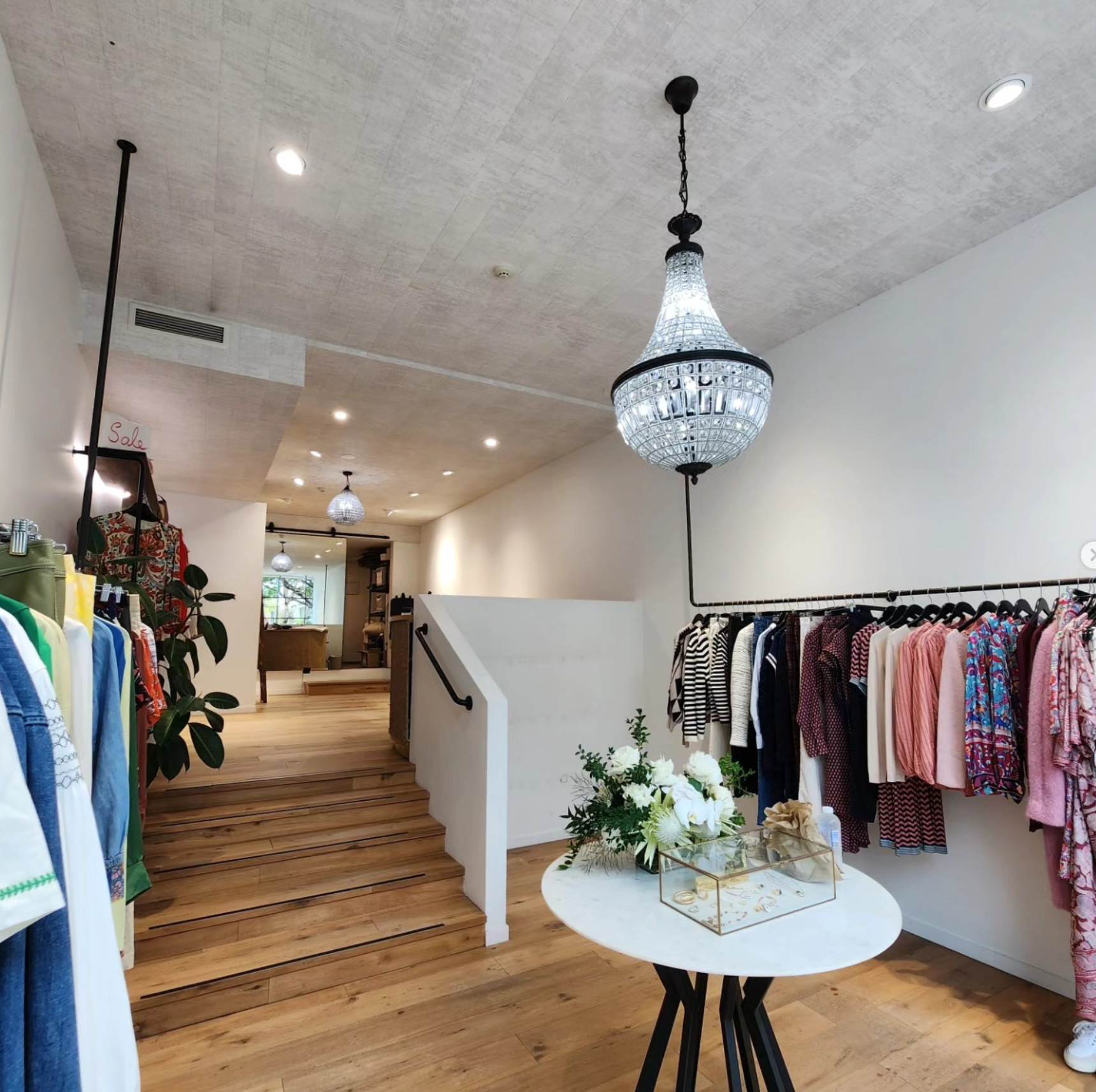 Crystal chandelier and downlights — luxury boutique clothing store fit-out Noosa