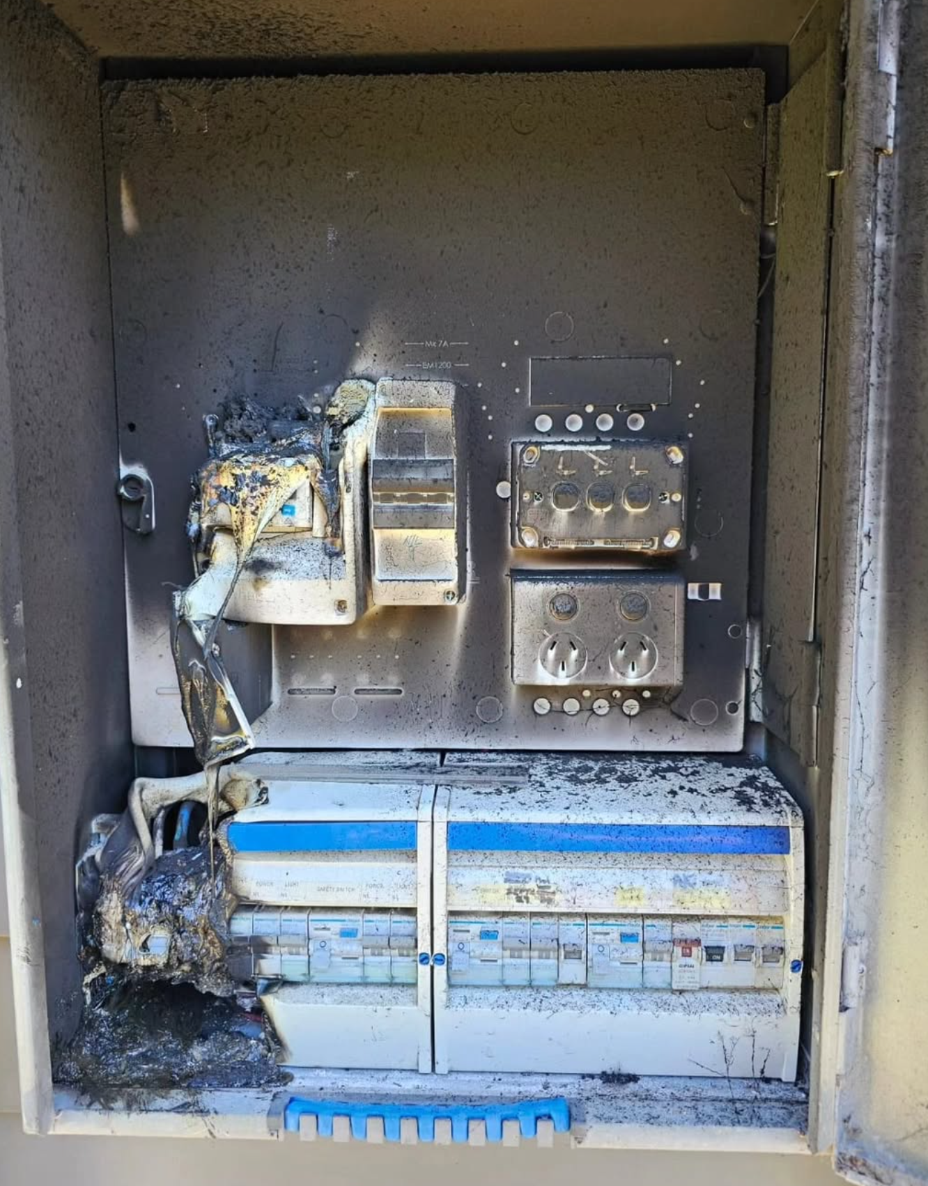Fire-damaged switchboard — before repair by Wave Electrical