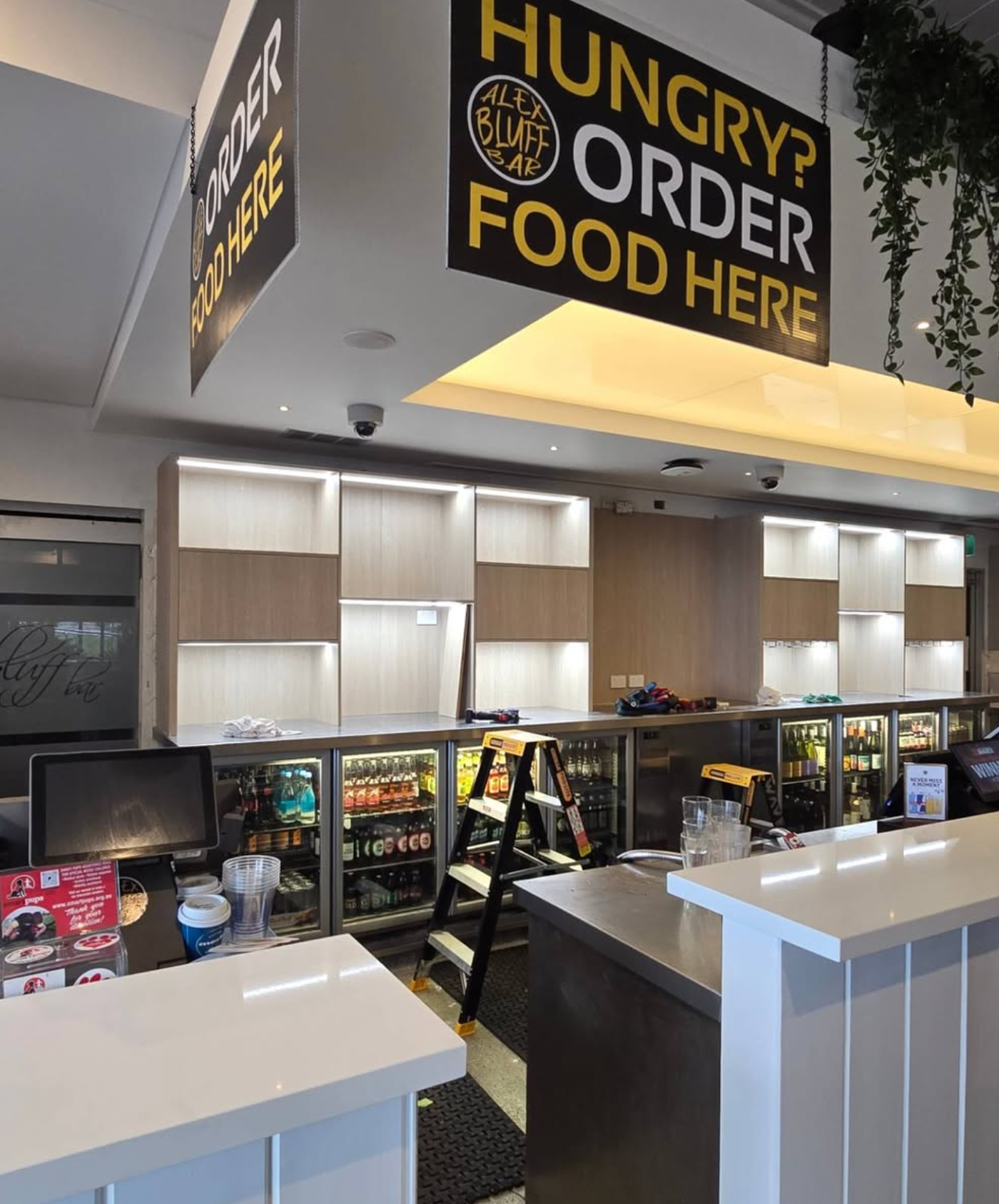 LED strip under-cabinet lighting at bar counter — Bluff Bar Noosa