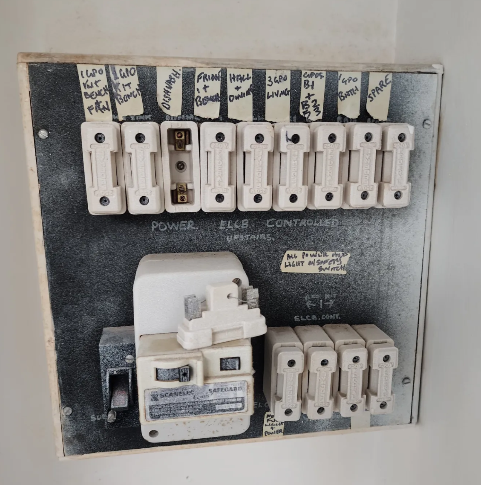 Old ceramic fuse board — before switchboard upgrade