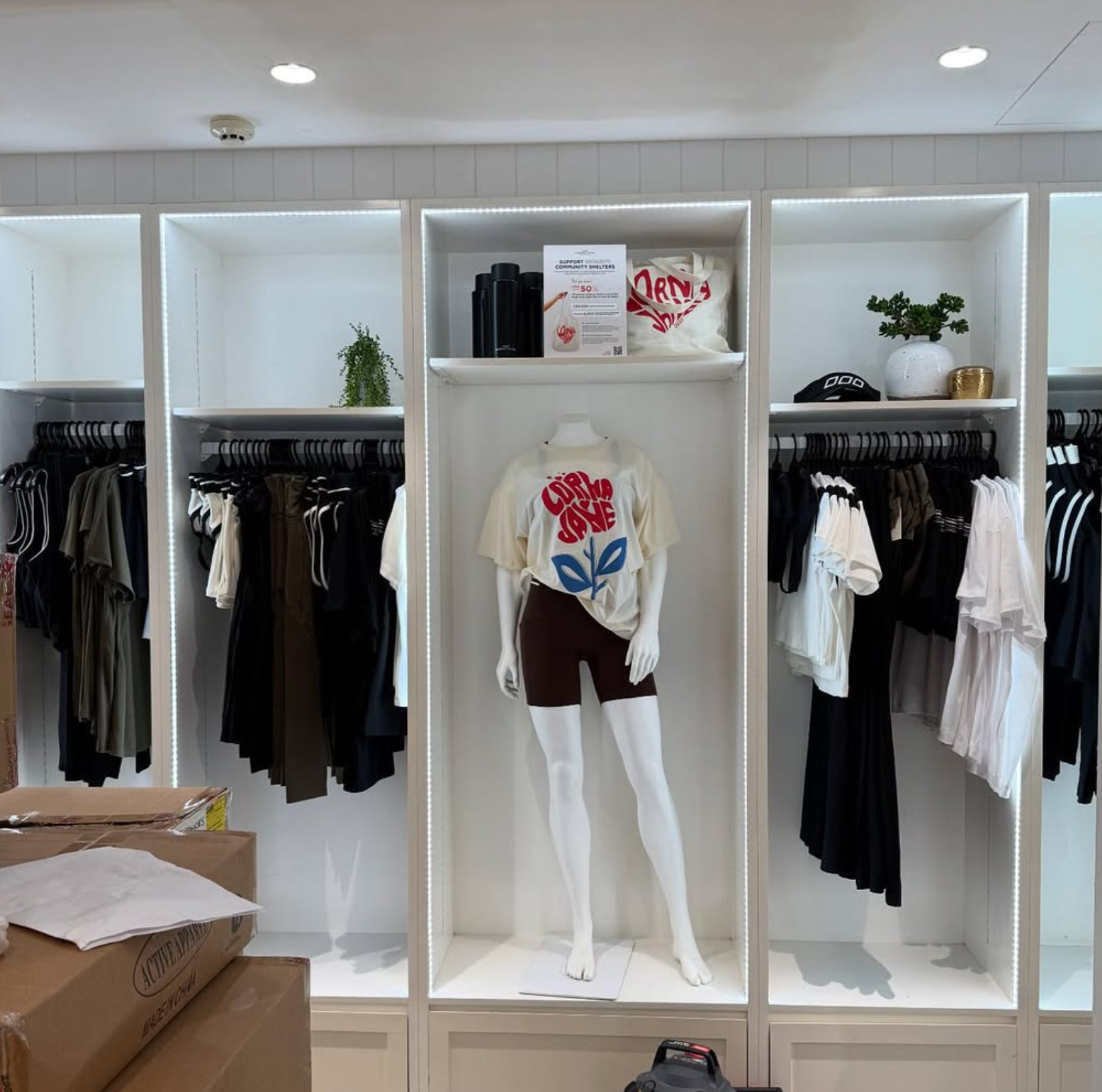 LED strip lit display cabinets inside Lorna Jane clothing store — retail fit-out Noosa