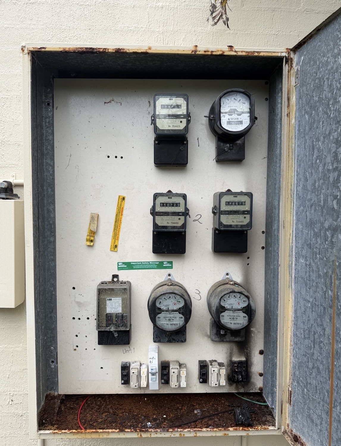 Old rusty switchboard with analog meters — before replacement Sunrise Beach
