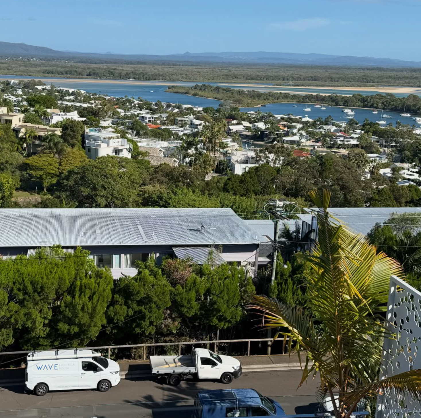 Wave Electrical van in Noosa with river and hinterland backdrop
